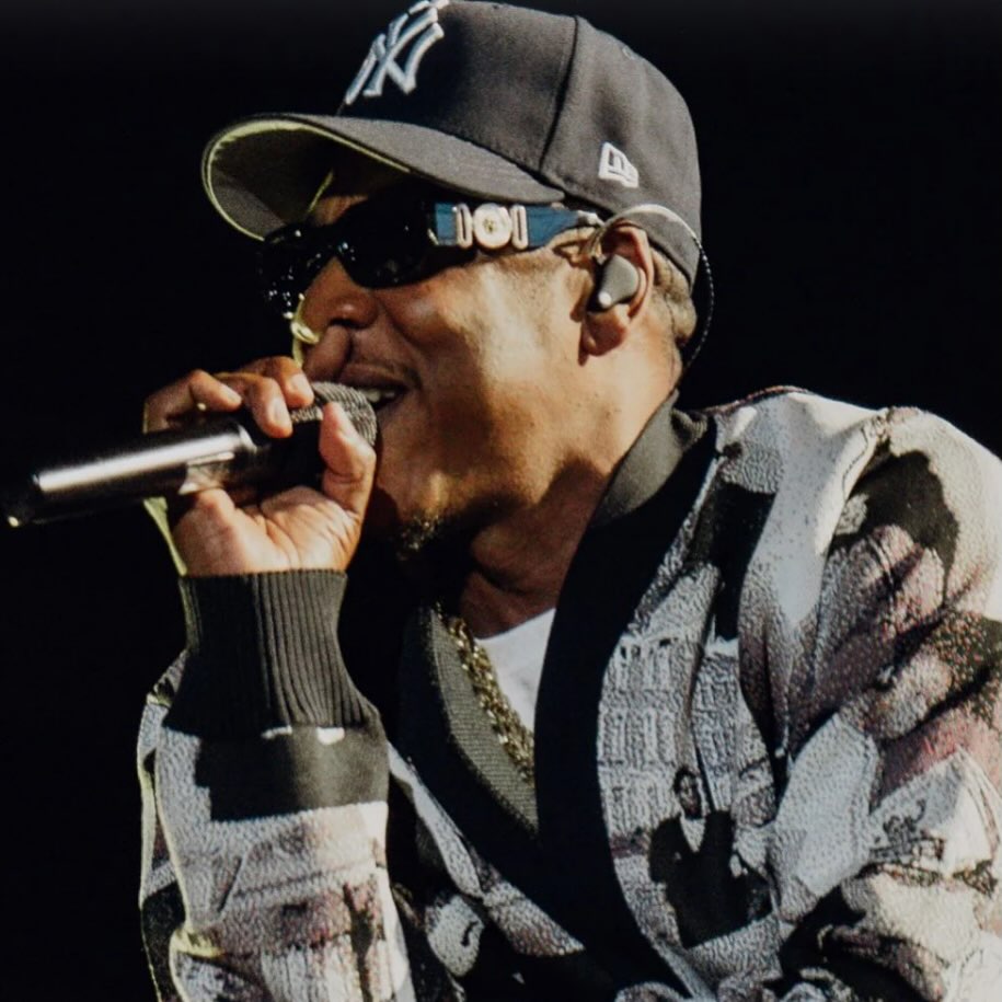 I need to talk about that Jay-Z concert.

I go to a few concerts. The biggest indulgence I spend on. Going out and seeing music.

I don’t even think of myself as a massive Jay-Z fan. But I think I am wrong. I think I am a massive Jay-Z fan but I actually had to see him live to realise it. 

The dude is 56 years old and inhabits a genre that values youth and the fresh and the relevant and yet I have never felt so much energy at a big concert. Every beat felt like the pulse of the present.

It was strangely minimal. I know that is a weird thing to say about a concert that featured film stars (Idris Elba on stage and Michael B Jordan watching) and a 22 piece orchestra and The Fugees and 70,000 people singing happy birthday to Beyoncé but I mean it was essentially just him. Just a man in a black hoodie prowling around the stage reciting banger after anthem after banger after anthem.

Like I saw A$AP Rocky recently and that concert featured a full blown warship and helicopters and high-flying stunts and AI graphics. It was basically the Spinal Tap of rap.

This had none of that.

No AI. Just a big screen showing real life footage of the Marcy projects he came from, or whatever. All the footage feeling more beautiful than usual by virtue of the fact we are so used to seeing AI in these contexts now.

It was a creative lesson. If you are good enough at what you do you don’t need props or AI or even a backing dancer. You just shine at what you do.

Not once did this feel like a retrospective nostalgia show. It felt like seeing the greatest rapper alive in a great moment.

The man who raps about Basquiat and crack dealing in the same breath fuses high and low in every line of jagged broken poetry. The power is how he balances opposing forces. 

“I move onward, the only direction/ Can’t be scared to fail in search of perfection.”

Five stars.