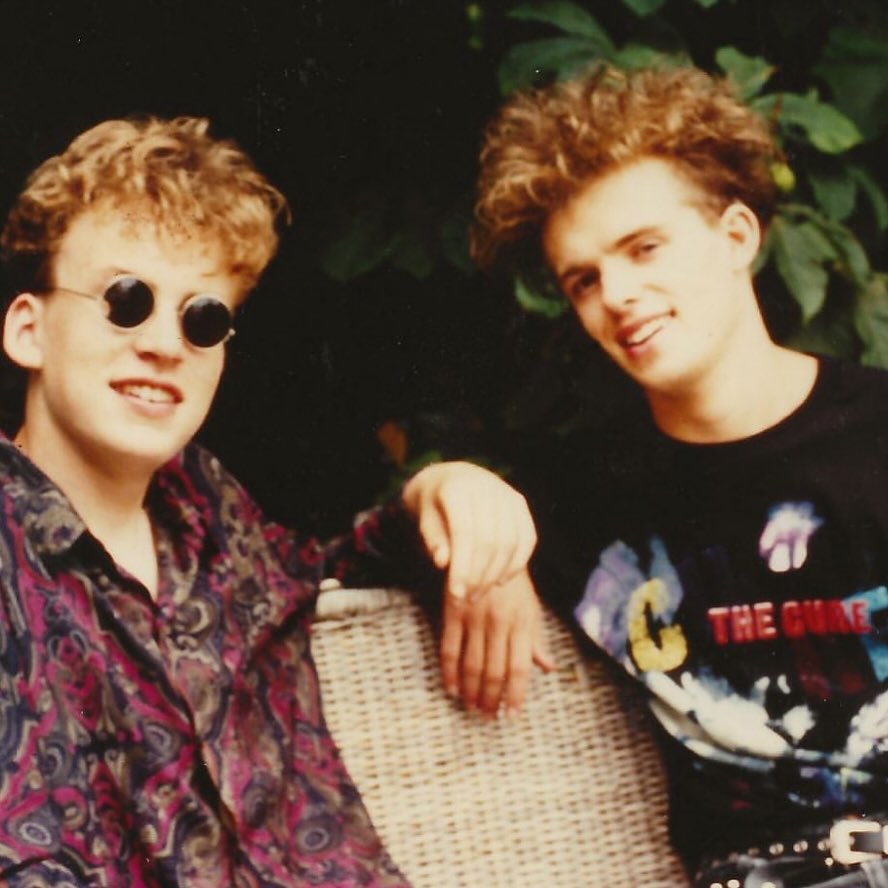 Me and my cousin James. The day we first saw The Cure. 23rd July 1989. He was the handsome one on the right. I was the one who looked like the character in a John Hughes movie who had an unrequited crush on Molly Ringwald while she yearned for a future yuppie in a Ferrari blasting OMD. 14 going on 33. I remember the day well. I had travelled to Sussex from Newark-on-Trent and met James and his friends. They were very cool. All eyeliner and bouffant hair. One was openly gay. A big deal for an 80s teenager. We went to London. Carnaby Street. I bought some John Lennon glasses, for some reason. And wore a paisley shirt I had made in Textiles. Then to Wembley for my first ever concert and  the closest thing to a spiritual experience I had as a teen. 10,000 boys in eyeliner and one in a paisley shirt. I remember the setlist. Charlotte Sometimes, A Forest, Lullaby, Inbetween Days… as I said earlier this week The Cure are a band you live inside. I was a troubled kid. Mildly criminal. Special needs. Misunderstood. Misfit. But the Cure provided a world for us to live inside. They gave us a place inside our minds for us to exist in the safe gothic shade of the imagination.